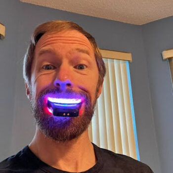 Dr. Tom using the Red and Blue LED Tooth Whitening System by Primal Life Organics